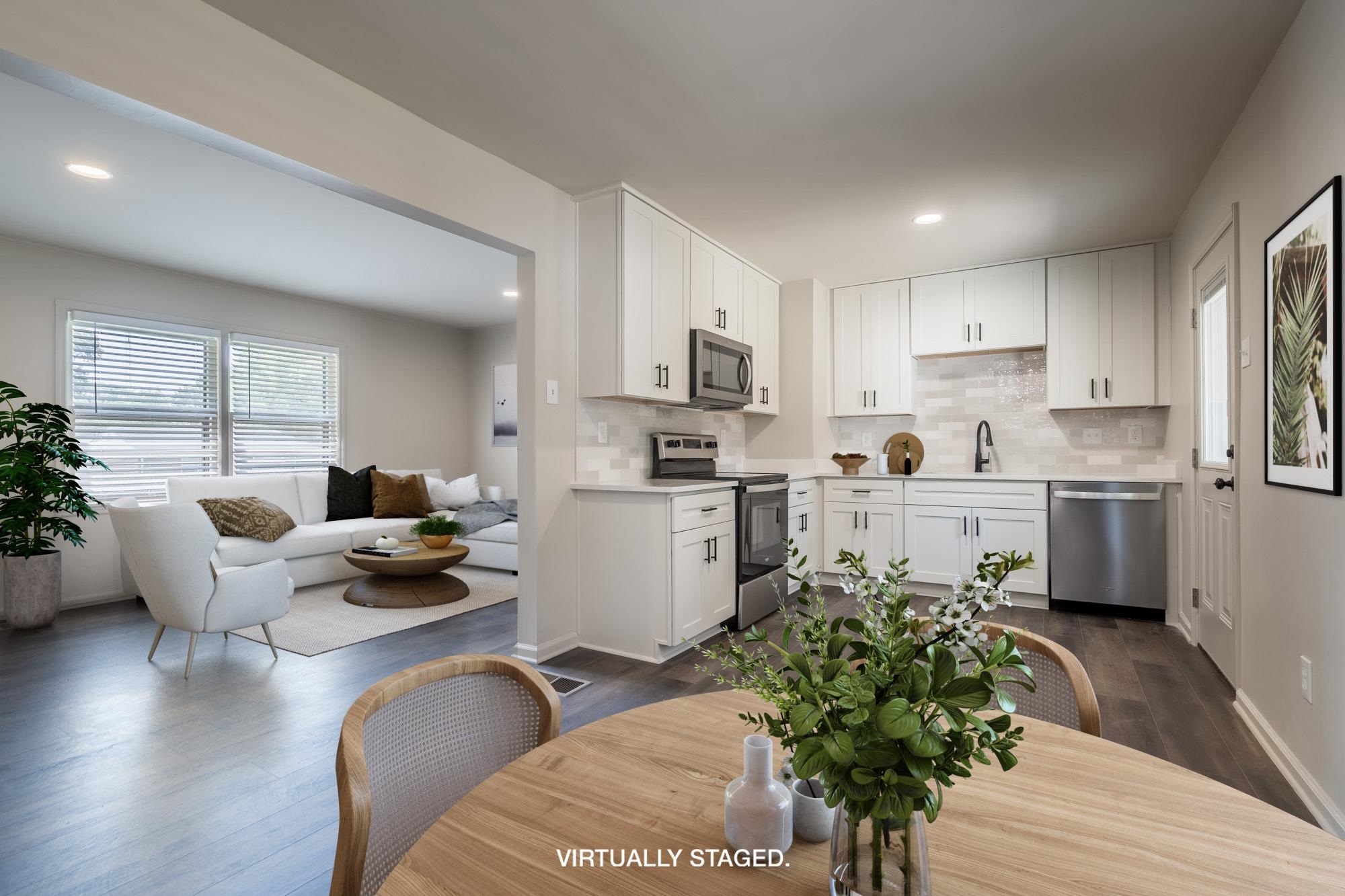 1014 Wellsville Road Memphis, TN 38117 - Photo 9 of 25 a kitchen with counter top space a sink appliances and cabinets