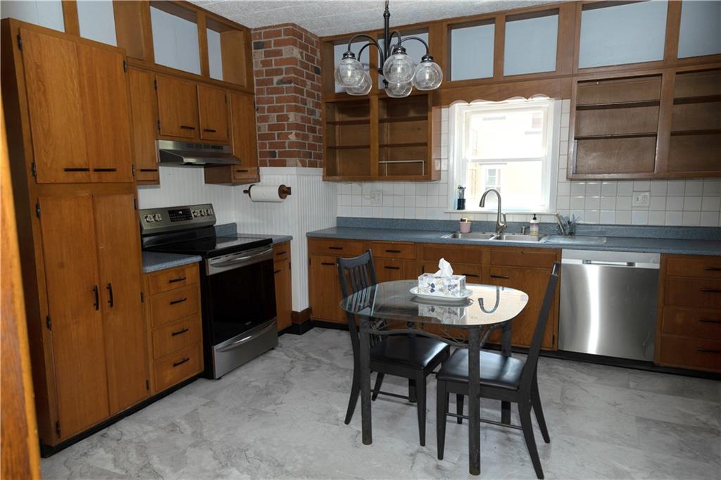 513 Lambertsville Road Stoystown, PA 15563 - Photo 16 of 49 a kitchen with stainless steel appliances granite countertop a sink and cabinets
