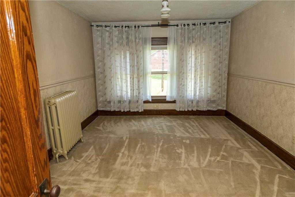 513 Lambertsville Road Stoystown, PA 15563 - Photo 21 of 49 a view of a door with wooden walls