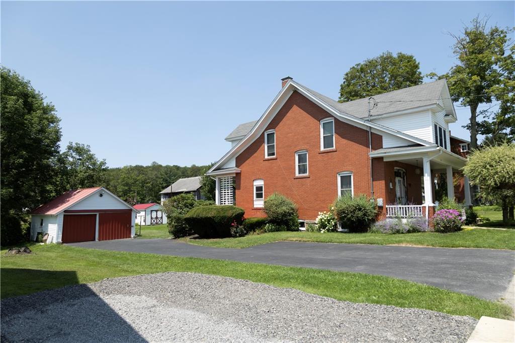 513 Lambertsville Road Stoystown, PA 15563 - Photo 4 of 49 a front view of a house with a garden