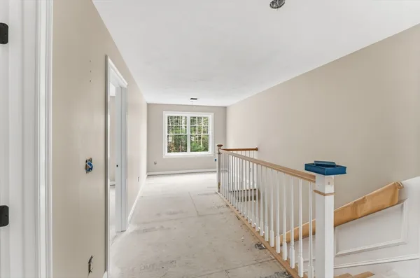 a view of a hallway with a window