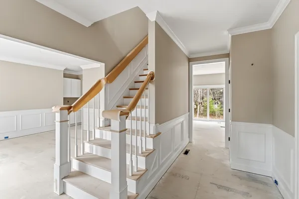 a view of entryway with stairs and wooden floor