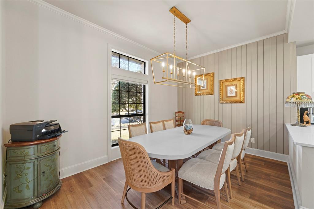 1413 Windsor Way Rowlett, TX 75088 - Photo 19 of 38 a view of a dining room with furniture wooden floor and chandelier