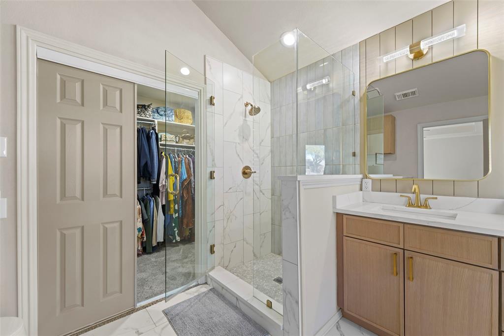 1413 Windsor Way Rowlett, TX 75088 - Photo 24 of 38 a bathroom with a shower sink and mirror