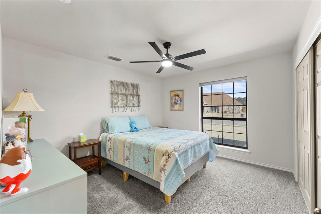 1413 Windsor Way Rowlett, TX 75088 - Photo 25 of 38 a bedroom with a bed and a window