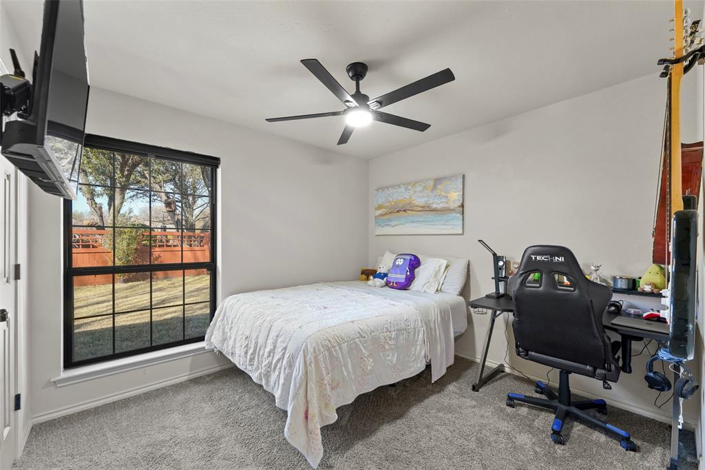 1413 Windsor Way Rowlett, TX 75088 - Photo 27 of 38 a bedroom with a bed and a window