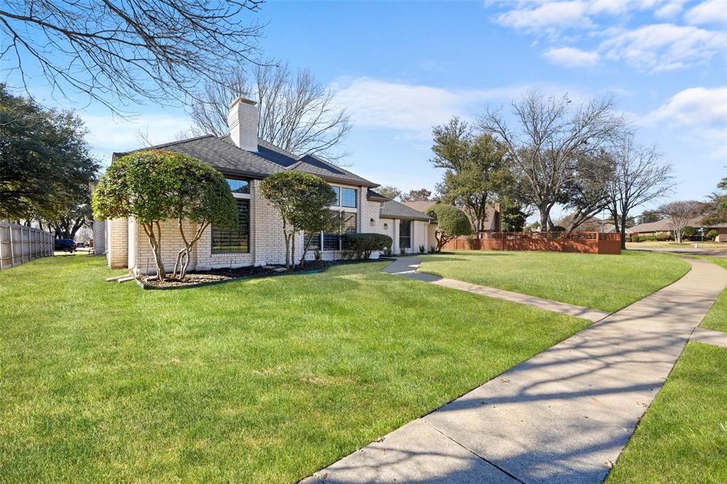 1413 Windsor Way Rowlett, TX 75088 - Photo 5 of 38 a view of a house with a big yard
