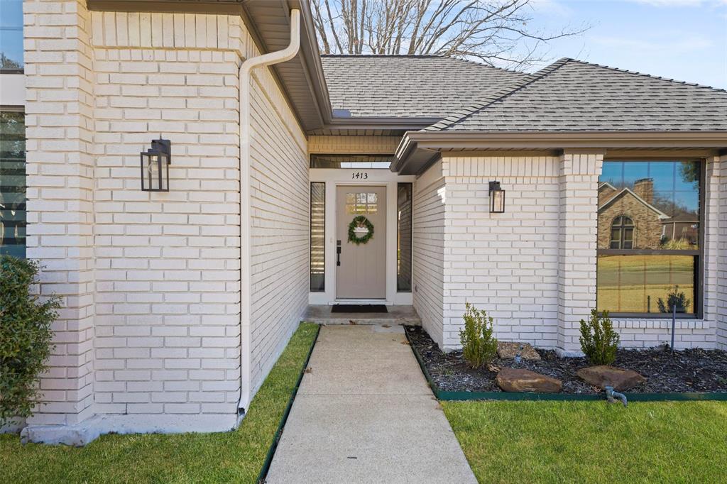 1413 Windsor Way Rowlett, TX 75088 - Photo 7 of 38 a front view of a house with garden