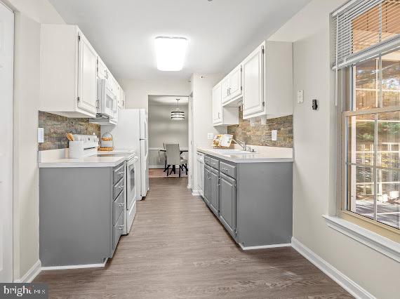 203 Star Pointe Court, Unit 2C Abingdon, MD 21009 - Photo 12 of 29 a kitchen with stainless steel appliances a sink stove and cabinets