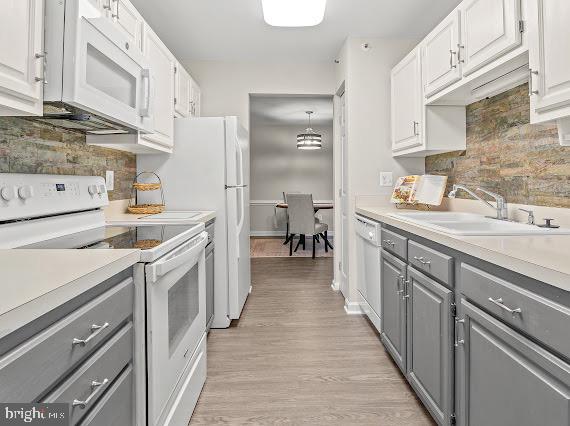203 Star Pointe Court, Unit 2C Abingdon, MD 21009 - Photo 14 of 29 a kitchen with a sink stove and cabinets
