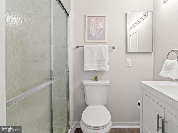 203 Star Pointe Court, Unit 2C Abingdon, MD 21009 - Photo 18 of 29 a white toilet sitting next to a bathroom sink