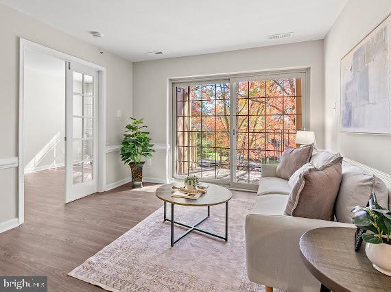203 Star Pointe Court, Unit 2C Abingdon, MD 21009 - Photo 2 of 29 a living room with furniture and a potted plant