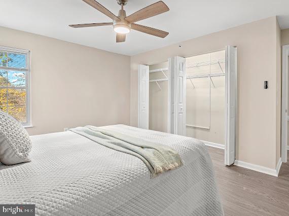 203 Star Pointe Court, Unit 2C Abingdon, MD 21009 - Photo 21 of 29 a bedroom with a large bed and a chandelier