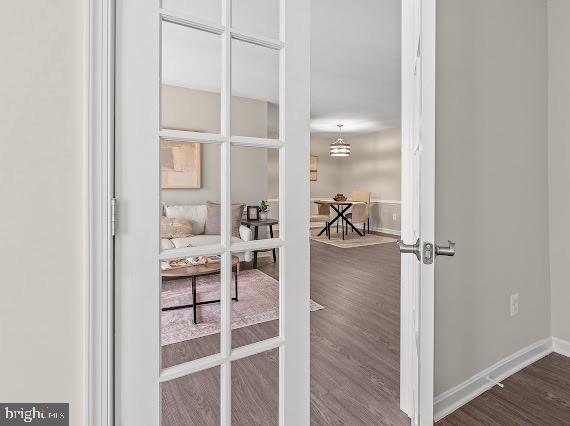 203 Star Pointe Court, Unit 2C Abingdon, MD 21009 - Photo 22 of 29 a view of a hallway with wooden floor and windows