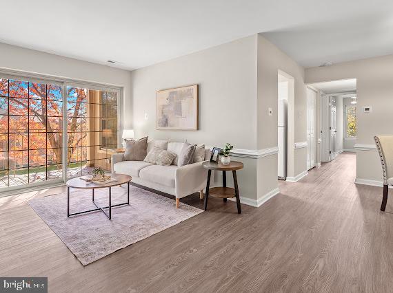 203 Star Pointe Court, Unit 2C Abingdon, MD 21009 - Photo 26 of 29 a living room with furniture and a large window