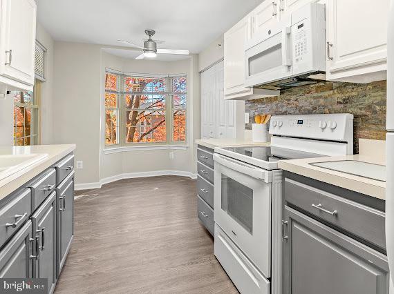 203 Star Pointe Court, Unit 2C Abingdon, MD 21009 - Photo 8 of 29 a kitchen with granite countertop white cabinets and white appliances