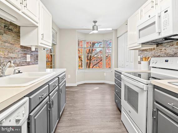 203 Star Pointe Court, Unit 2C Abingdon, MD 21009 - Photo 10 of 29 a kitchen with granite countertop a sink stove and cabinets