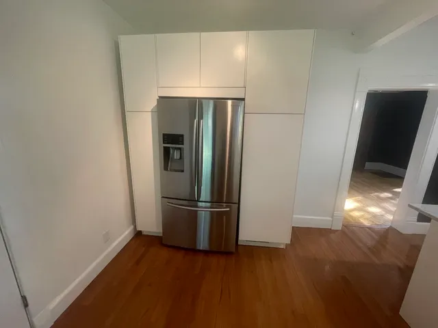 a bathroom with a bathtub a sink and a mirror