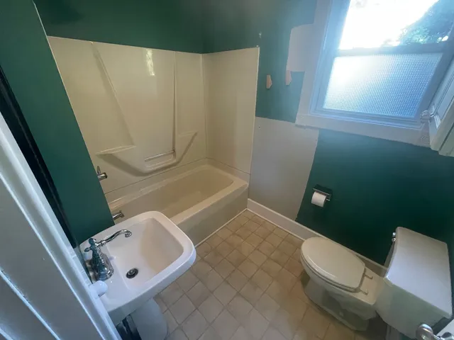 a view of an empty room with windows