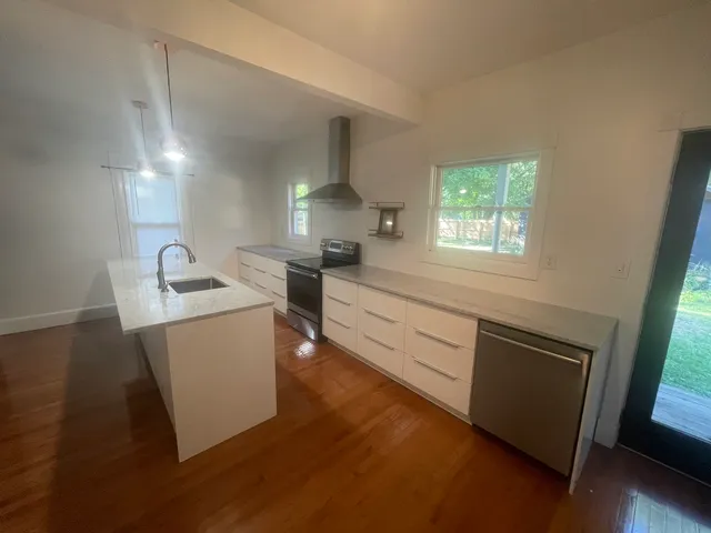 a bathroom with a sink a vanity and a mirror
