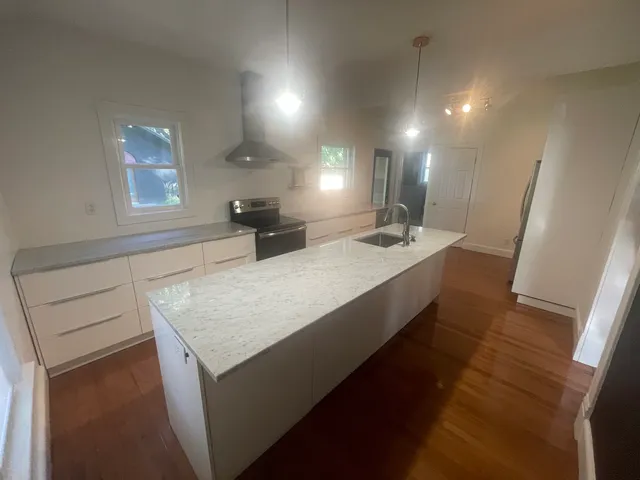 a kitchen with a stove and a refrigerator