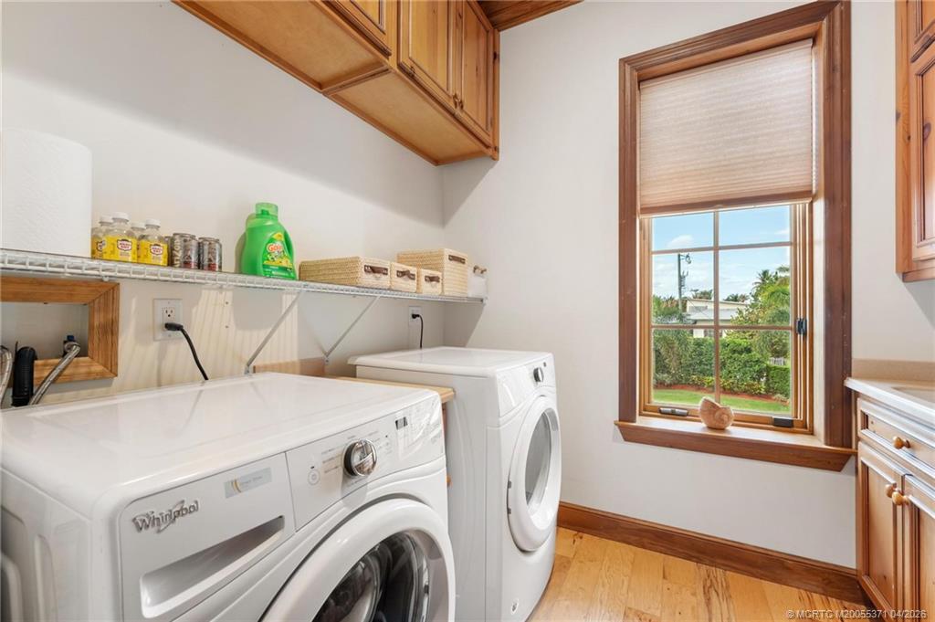 5675 Southeast Orange Street Stuart, FL 34997 - Photo 25 of 96 a utility room with dryer and washer