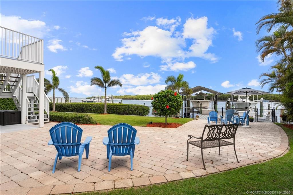 5675 Southeast Orange Street Stuart, FL 34997 - Photo 34 of 96 a view of a swimming pool and lounge chairs