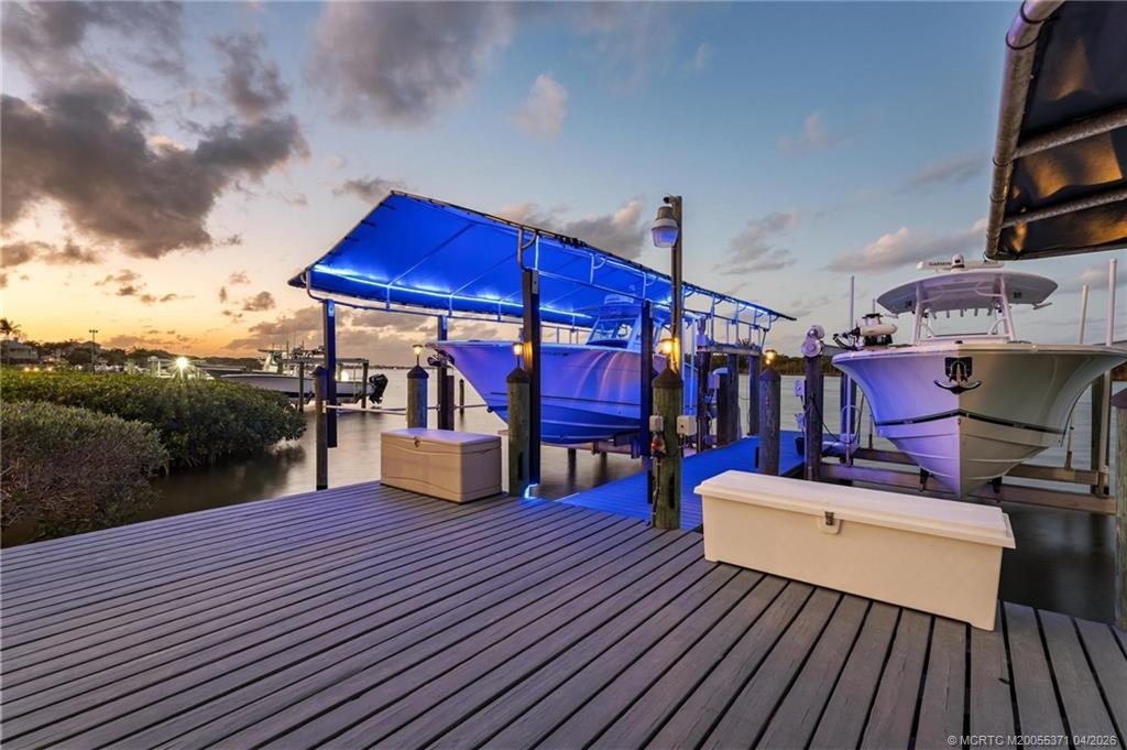 5675 Southeast Orange Street Stuart, FL 34997 - Photo 56 of 96 a view of a chairs and tables on the roof deck