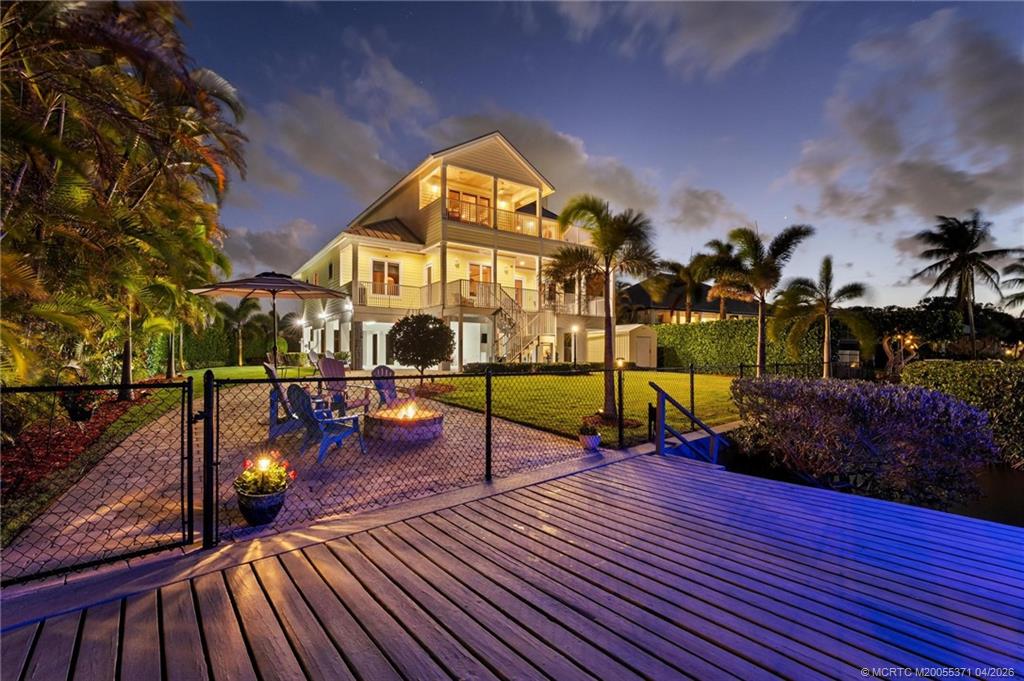 5675 Southeast Orange Street Stuart, FL 34997 - Photo 59 of 96 a view of a house with a swimming pool