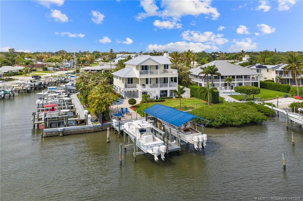 5675 Southeast Orange Street Stuart, FL 34997 - Photo 87 of 96 a view of a lake with houses