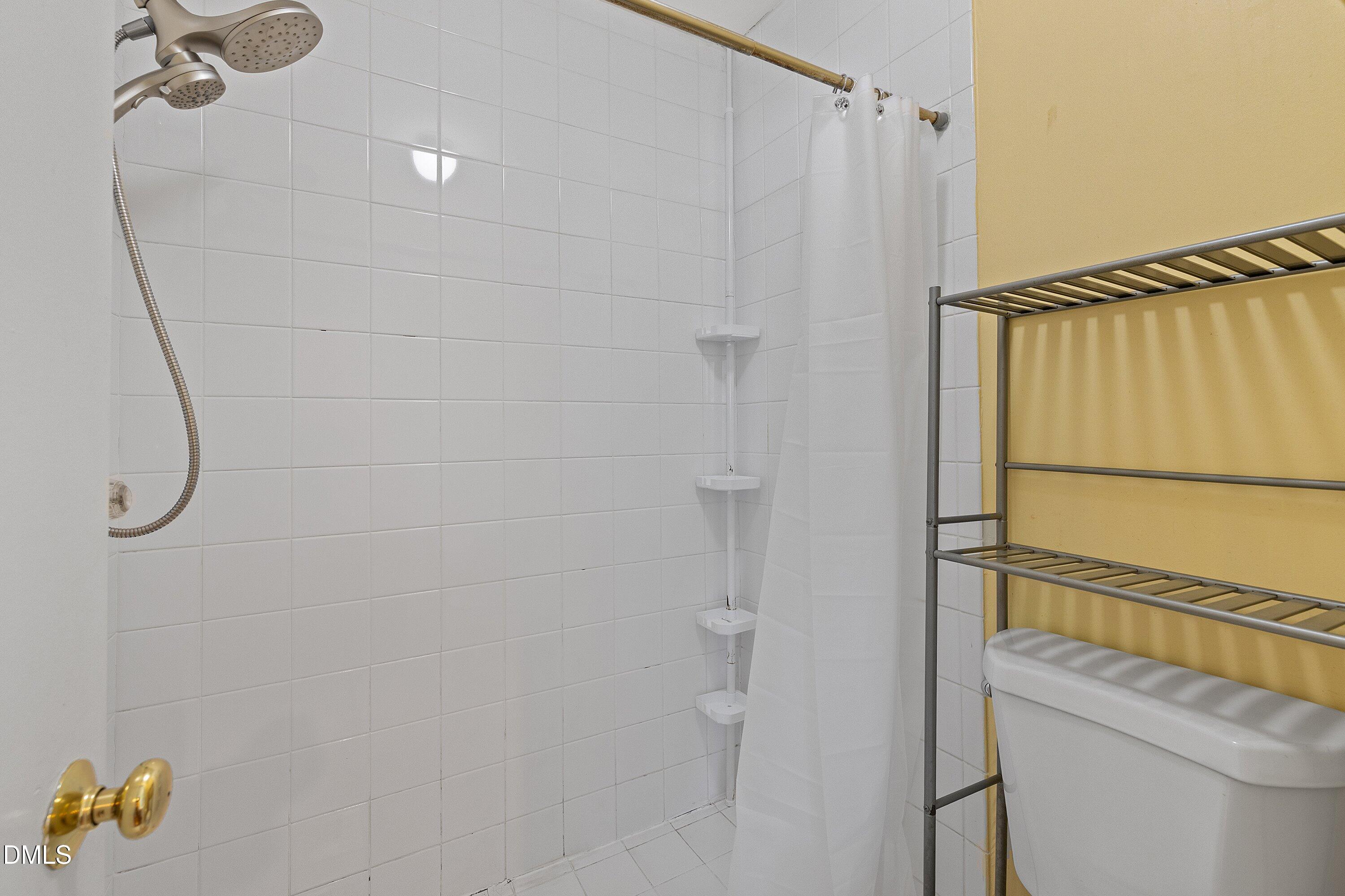 2400 Condor Court Raleigh, NC 27615 - Photo 28 of 40 a bathroom with a shower