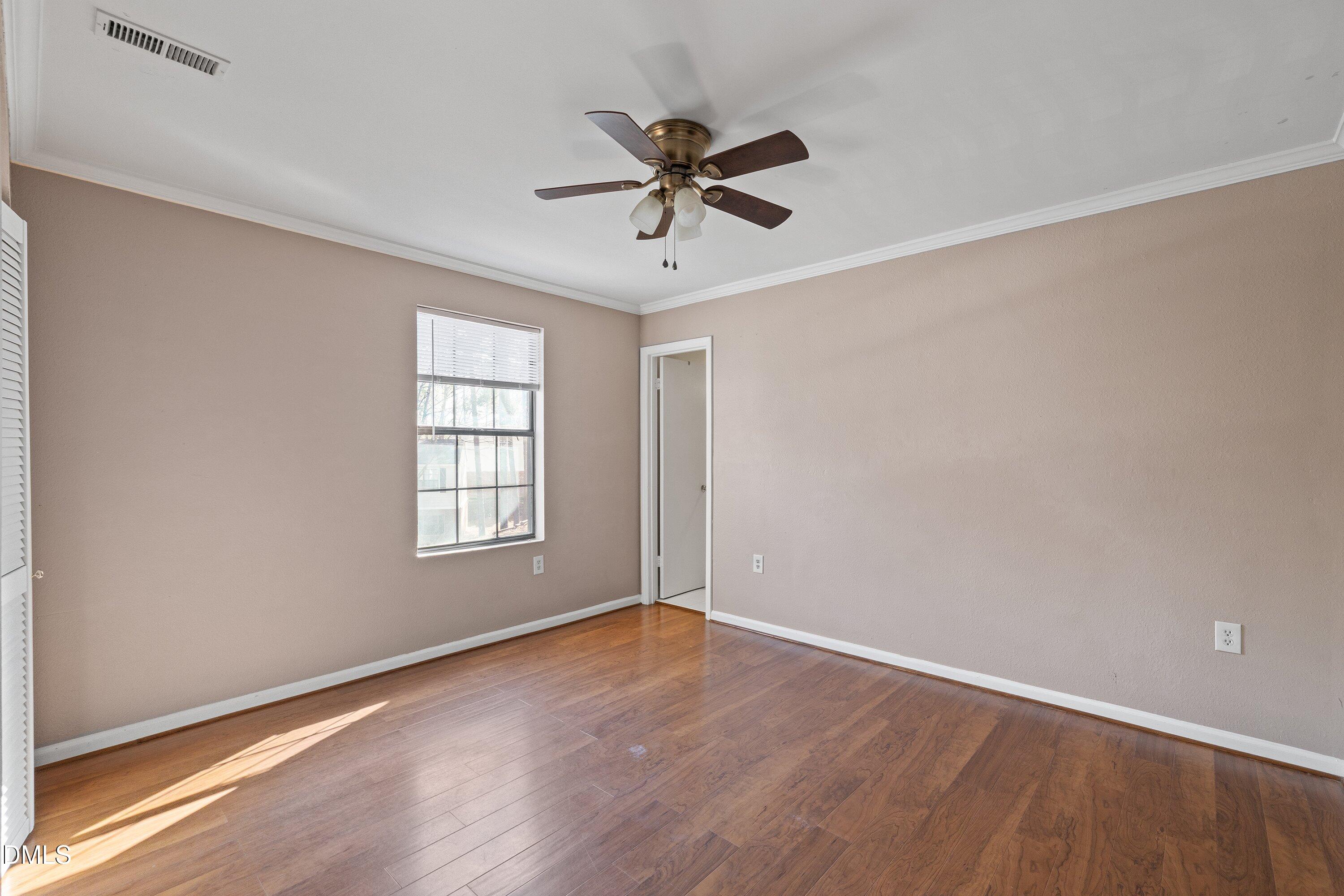 2400 Condor Court Raleigh, NC 27615 - Photo 30 of 40 wooden floor in an empty room with a window