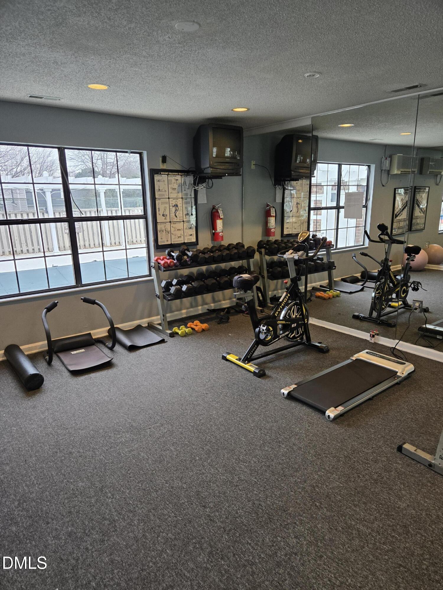 2400 Condor Court Raleigh, NC 27615 - Photo 37 of 40 a room with gym equipment and a large window