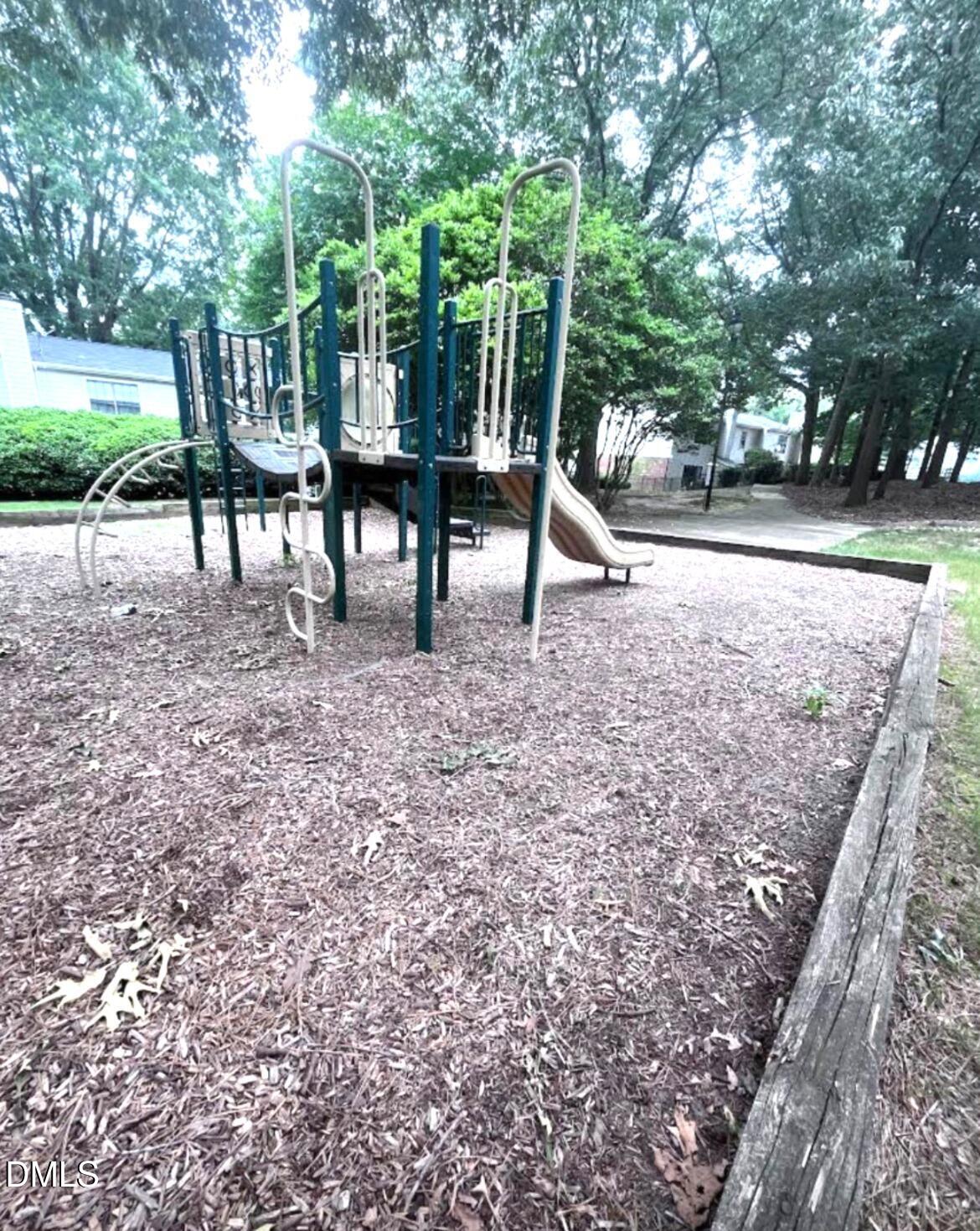 2400 Condor Court Raleigh, NC 27615 - Photo 39 of 40 a view of a yard with a slide