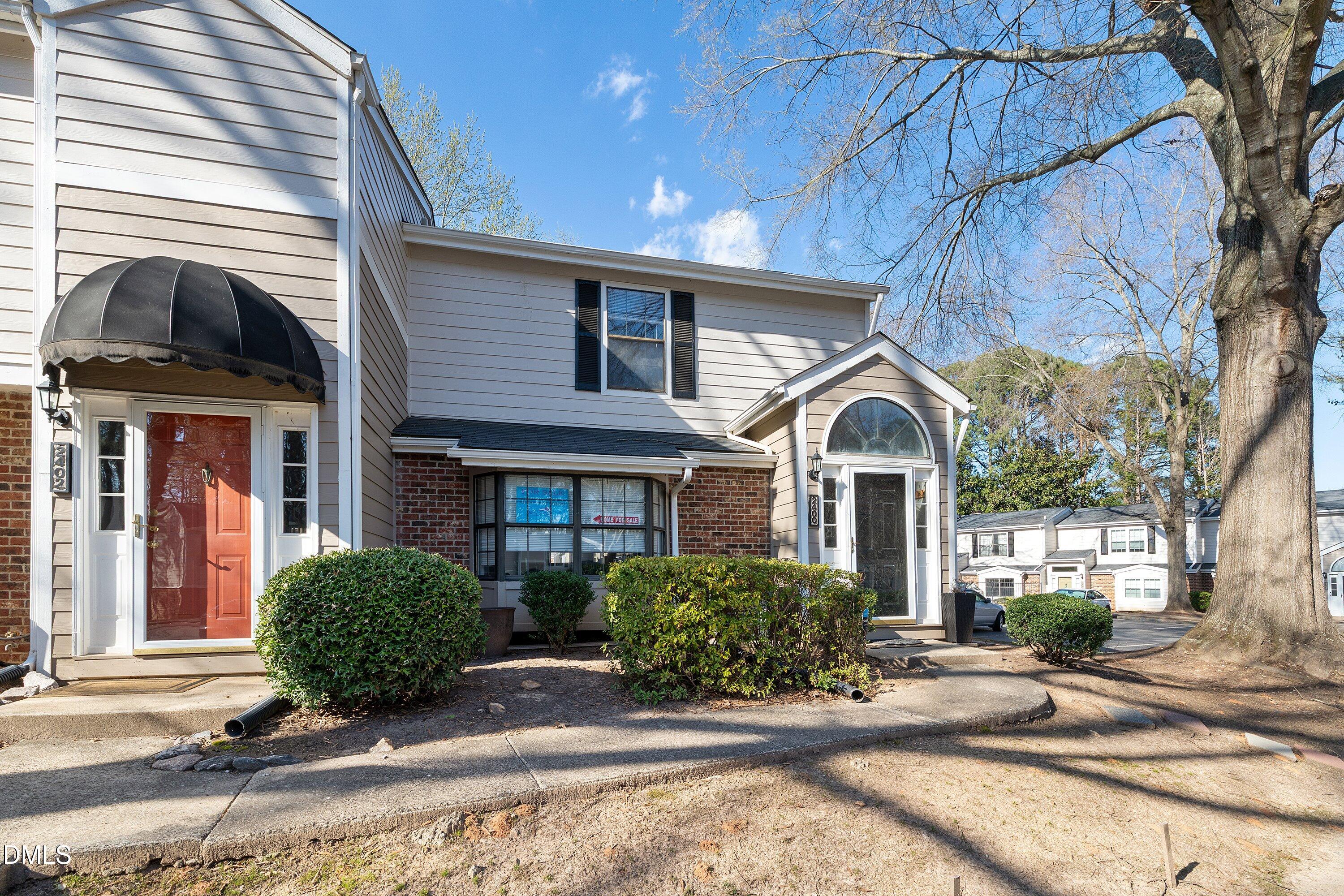 2400 Condor Court Raleigh, NC 27615 - Photo 4 of 40 a front view of a house with garden