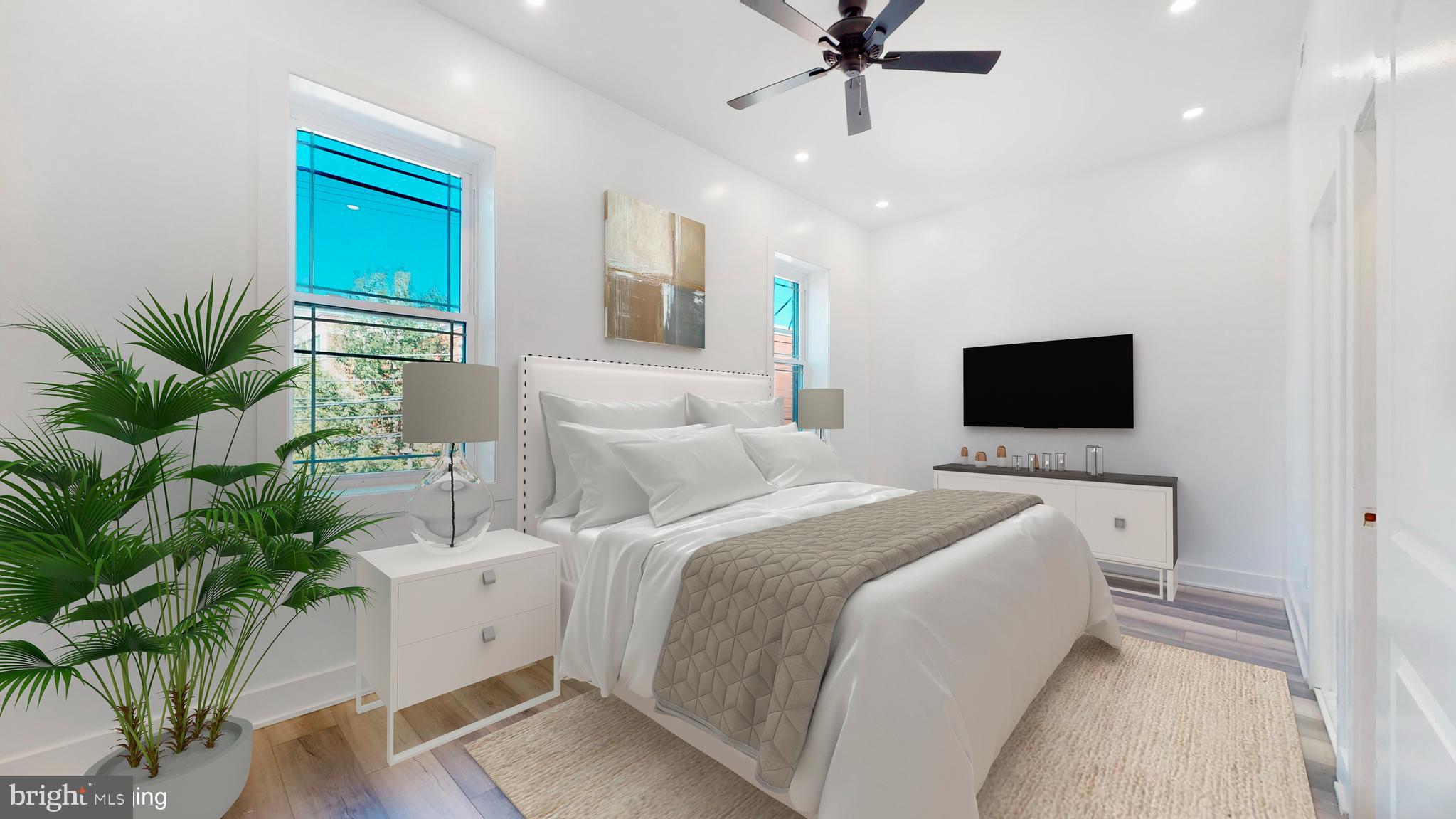 651 North 16th Street, Unit 2 Philadelphia, PA 19130 - Photo 15 of 19 a bed room with a bed and a television