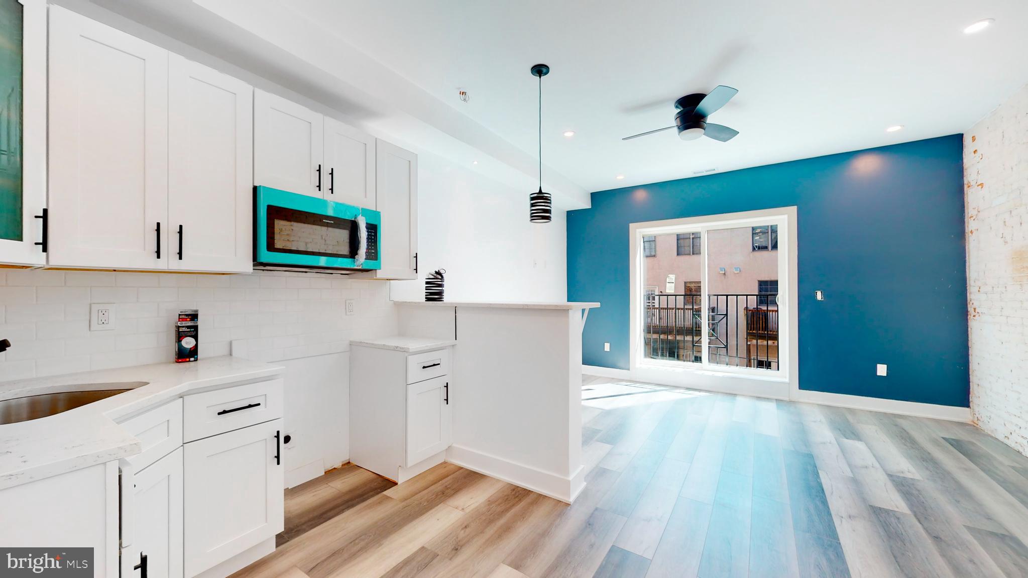 651 North 16th Street, Unit 2 Philadelphia, PA 19130 - Photo 2 of 19 a view of a kitchen with electric appliances