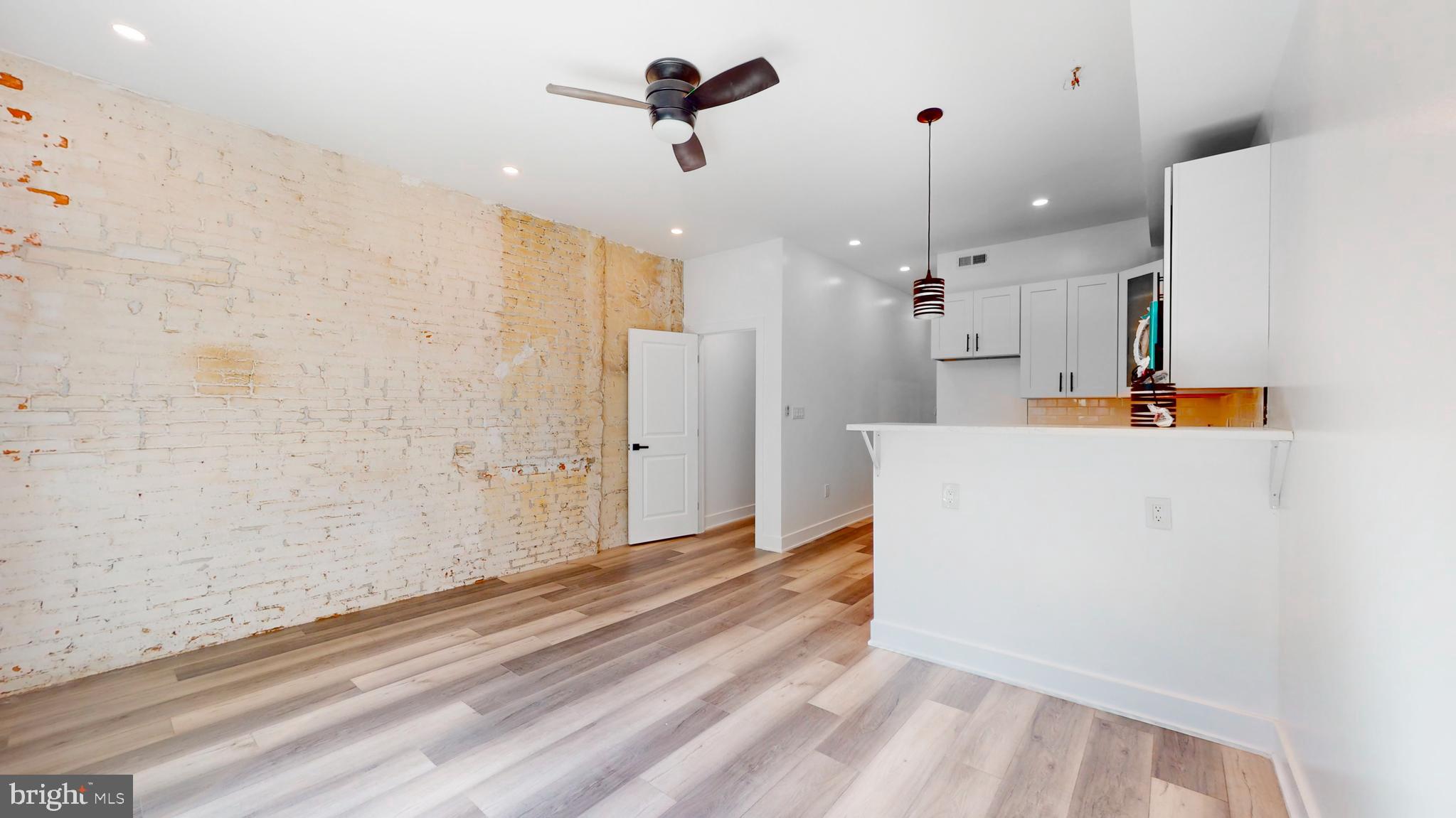 651 North 16th Street, Unit 2 Philadelphia, PA 19130 - Photo 4 of 19 a view of a kitchen with a sink and cabinets