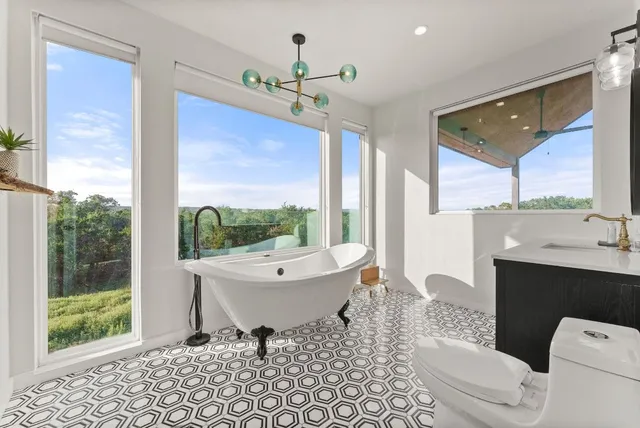 a bedroom with furniture and a mirror