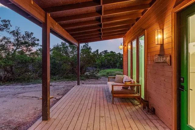a porch with outdoor seating