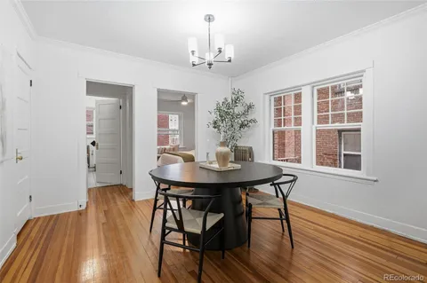 a view of a dining room with furniture and window