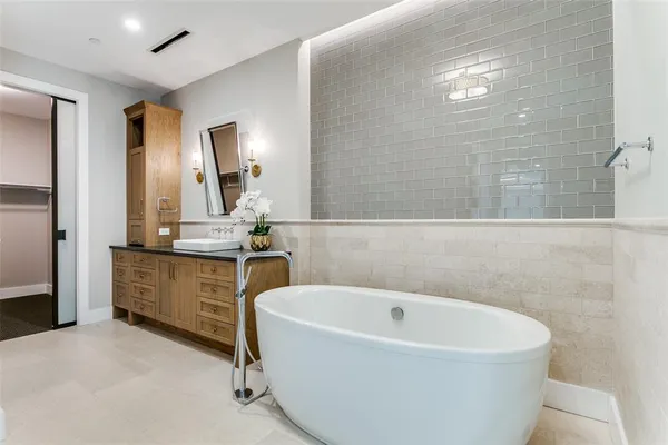 a bathroom with a bathtub and a sink