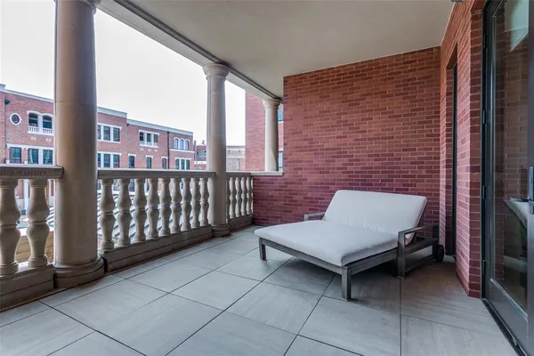 a brick building with a bench in front of it