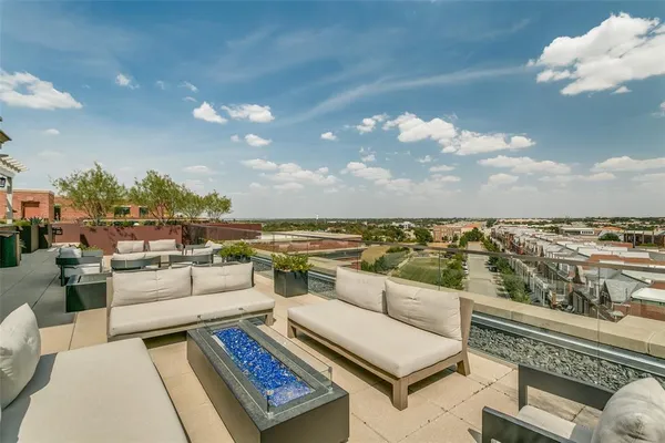 a view of roof deck with patio