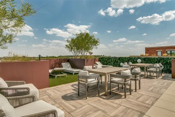 a view of a terrace with furniture and a table