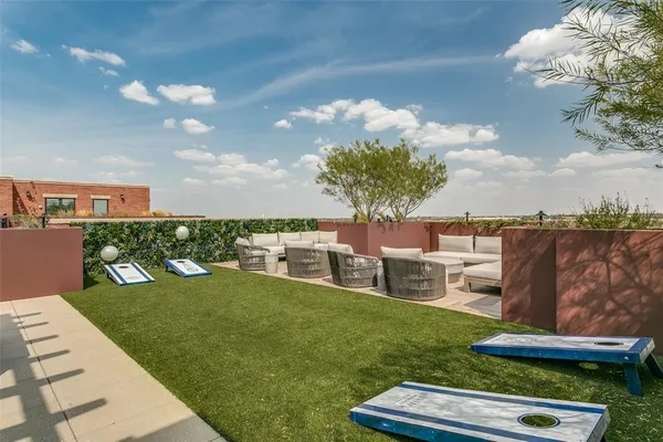 a view of a garden with lawn chairs