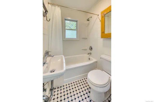 a bathroom with a toilet a sink and a bathtub