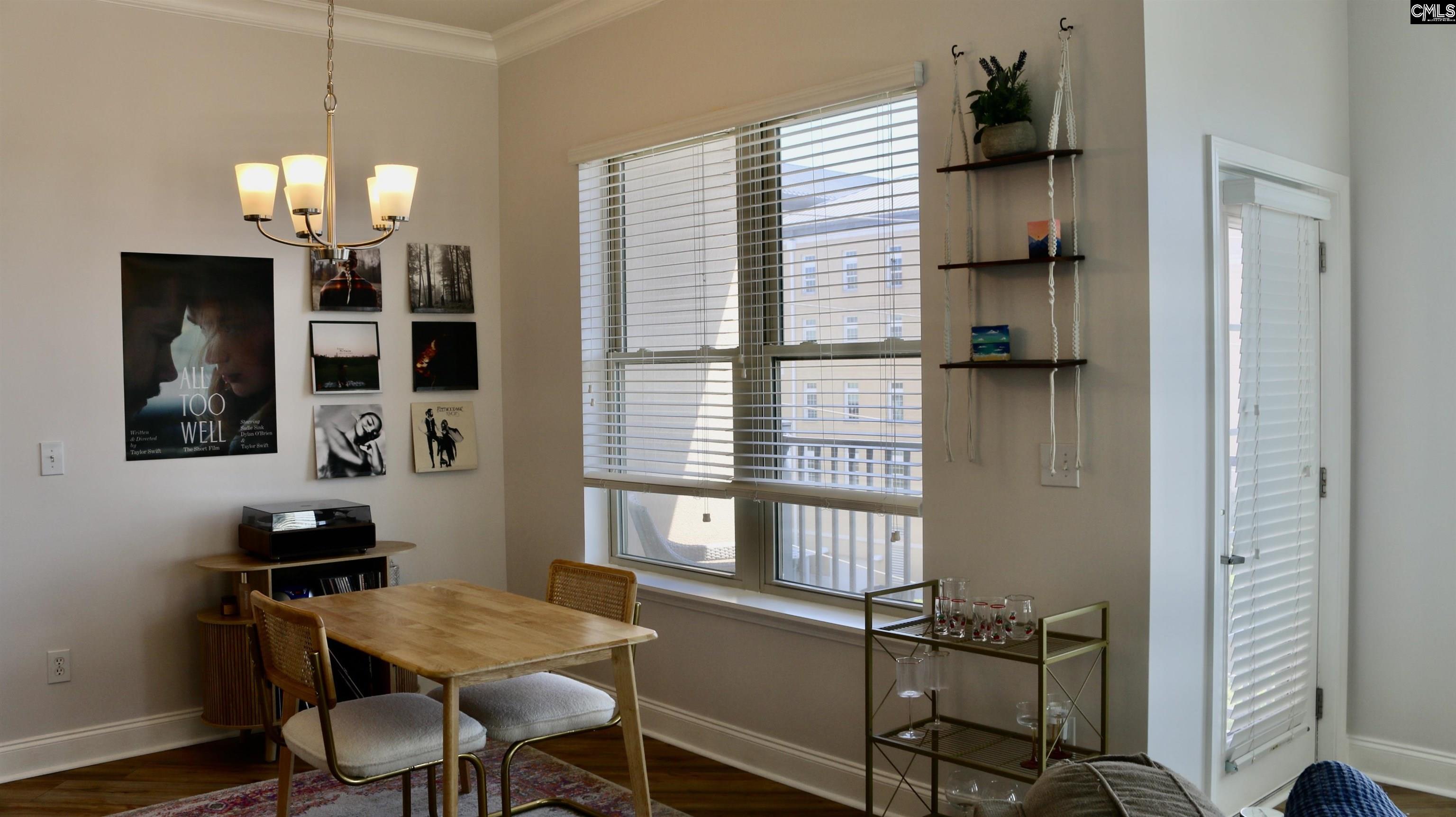 601 Main Street, Unit 323 Columbia, SC 29201 - Photo 21 of 68 a view of a dining room with furniture and a window