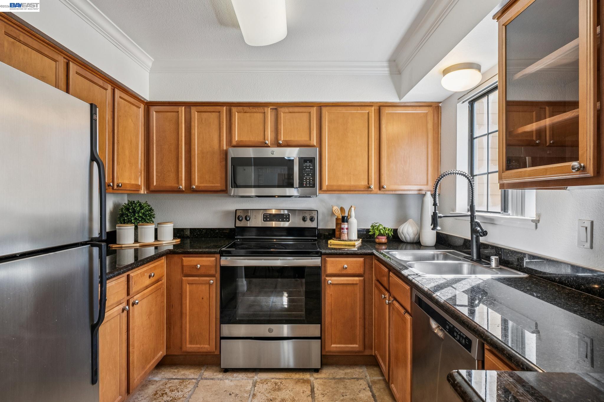 182 Eastridge Drive San Ramon, CA 94582 - Photo 11 of 54 a kitchen with stainless steel appliances granite countertop a stove a sink and a refrigerator
