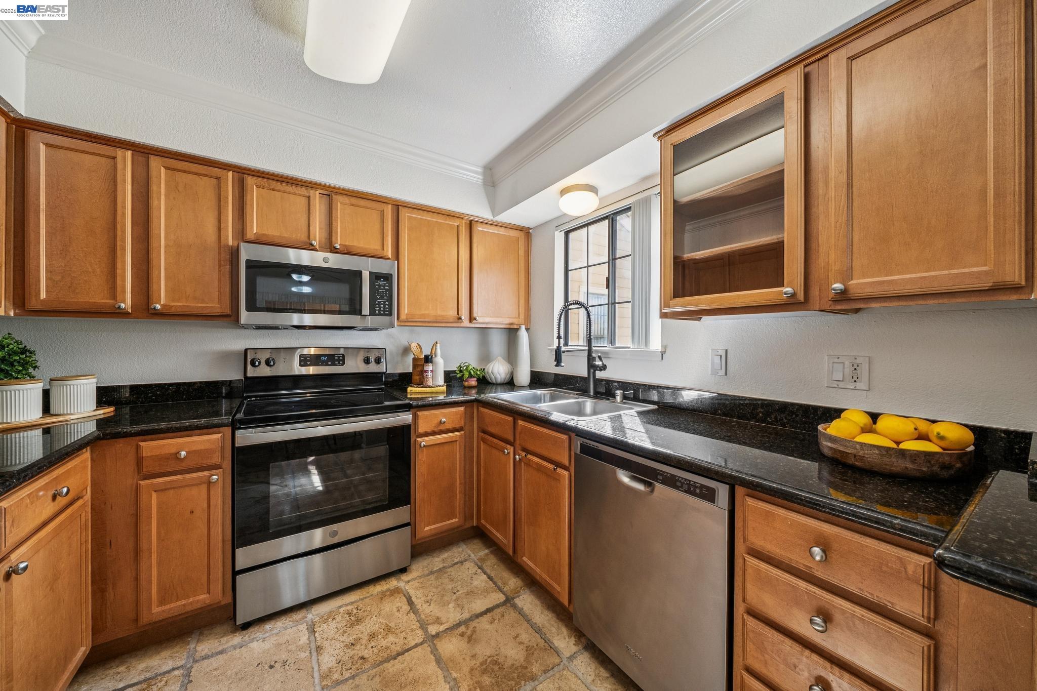 182 Eastridge Drive San Ramon, CA 94582 - Photo 12 of 54 a kitchen with stainless steel appliances granite countertop a sink stove and microwave
